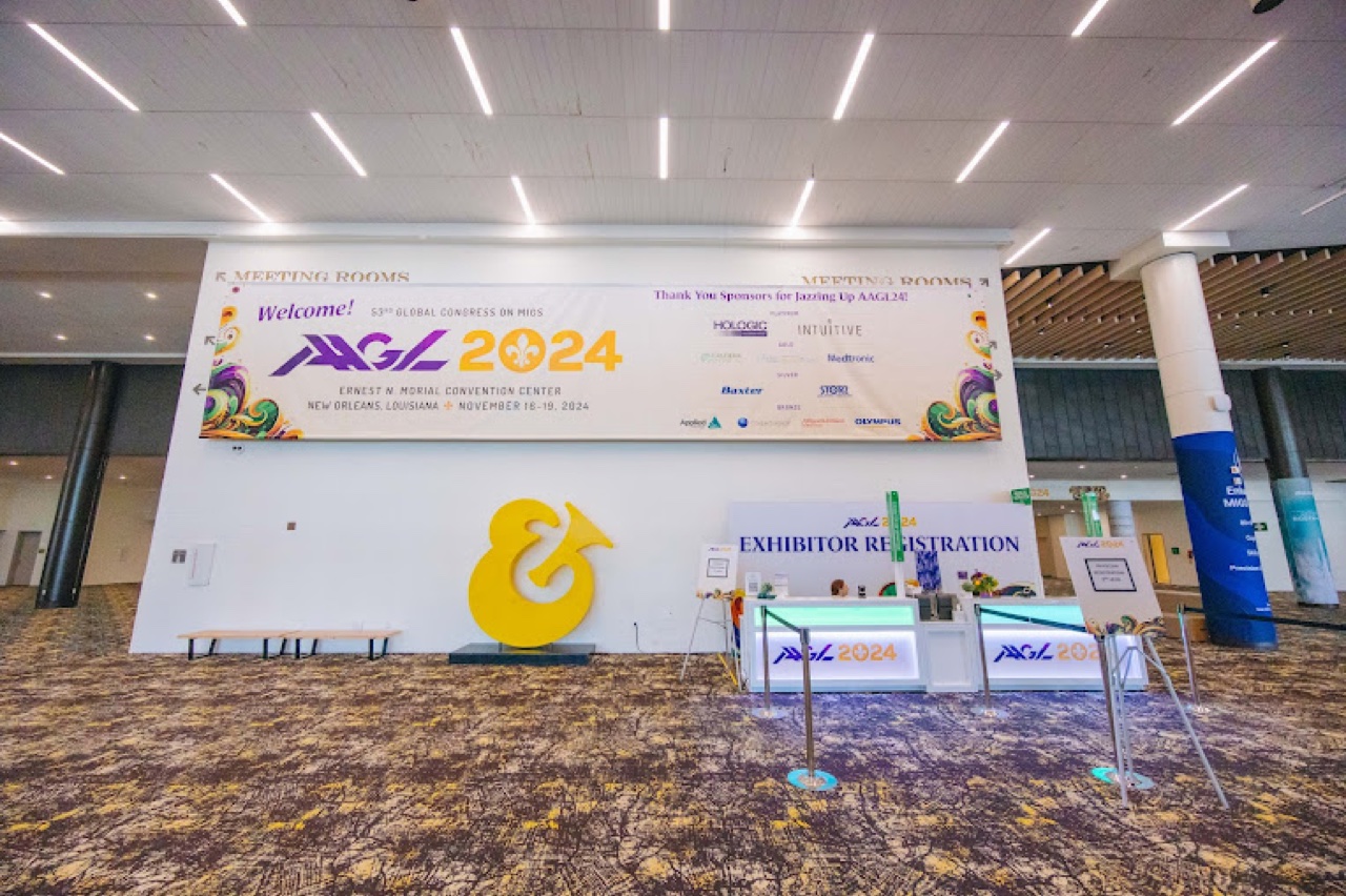 AAGL 2024 welcome wall with large format banner, sponsor signage, and 3D branded letters